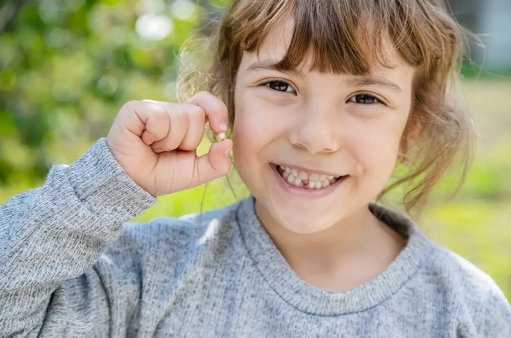 the-kid-had-a-baby-tooth-selective-focus