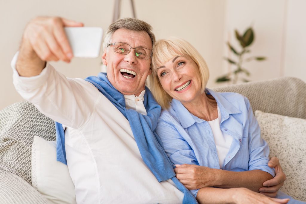 modern grandparents taking selfie on cellphone res 76VY4WJ min - Channel Islands Family Dental Office | Dentist In Ventura County