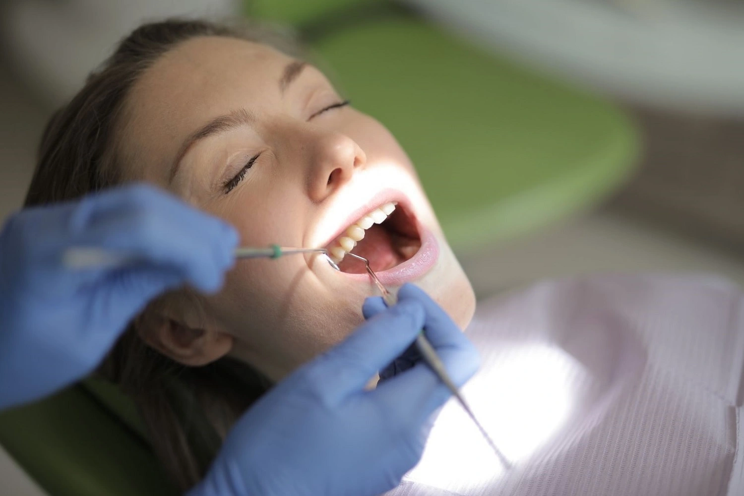 dentist-performing-a-complete-oral-exam