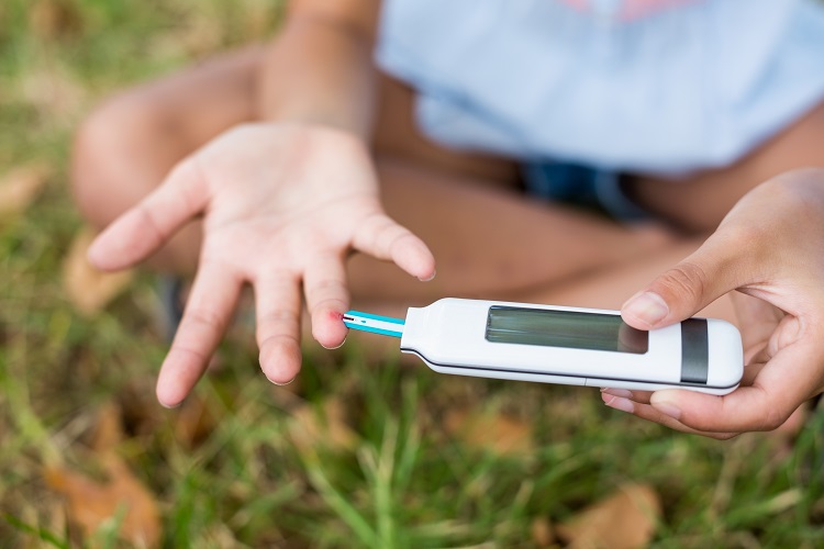 girl-testing-diabetes-on-glucose-meter