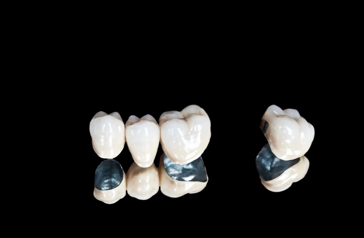 close-up-dental-crowns-on-black-background