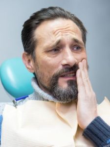 man having toothache