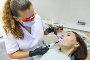a woman getting her teeth checked