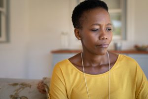 Sad mature black woman alone