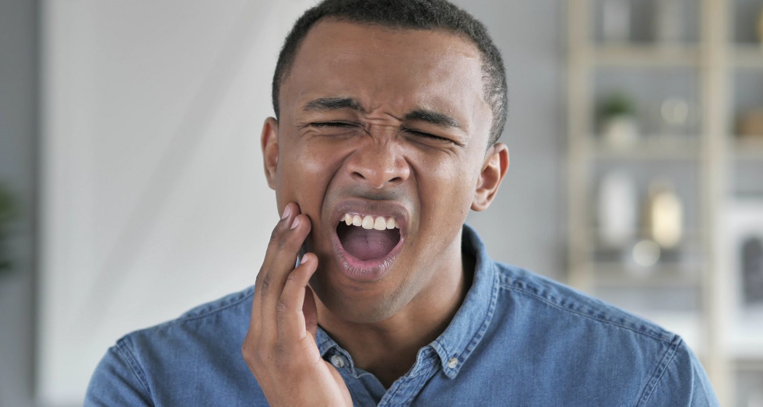 man with tooth infection spreading to the body