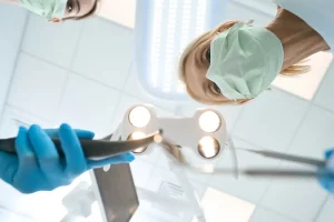 dentists-performing-tooth-extraction