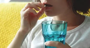 Girl taking medicine