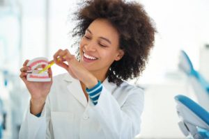 dentist showing how to brush