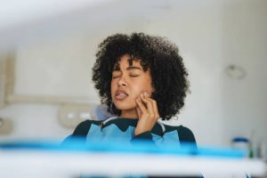 young woman suffering from toothache