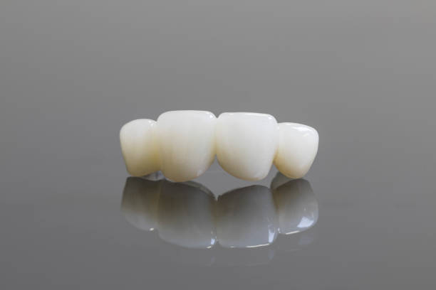 Dental ceramic crowns or zirconium dental crowns on the dark background isolated