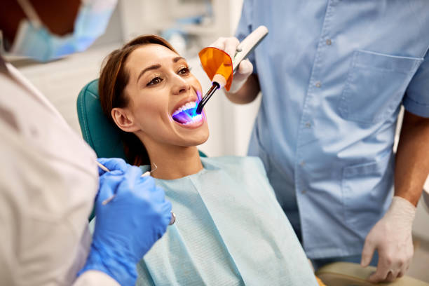 Young woman getting dental filling