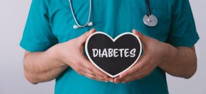 doctor-holding-a-heart-with-the-word-diabetes