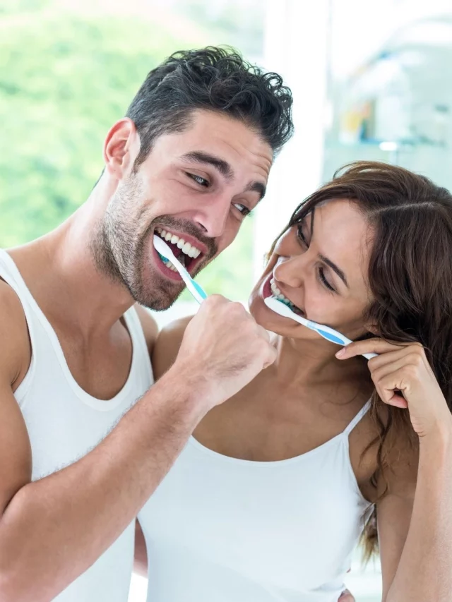 couple brushing their teeth 02232024