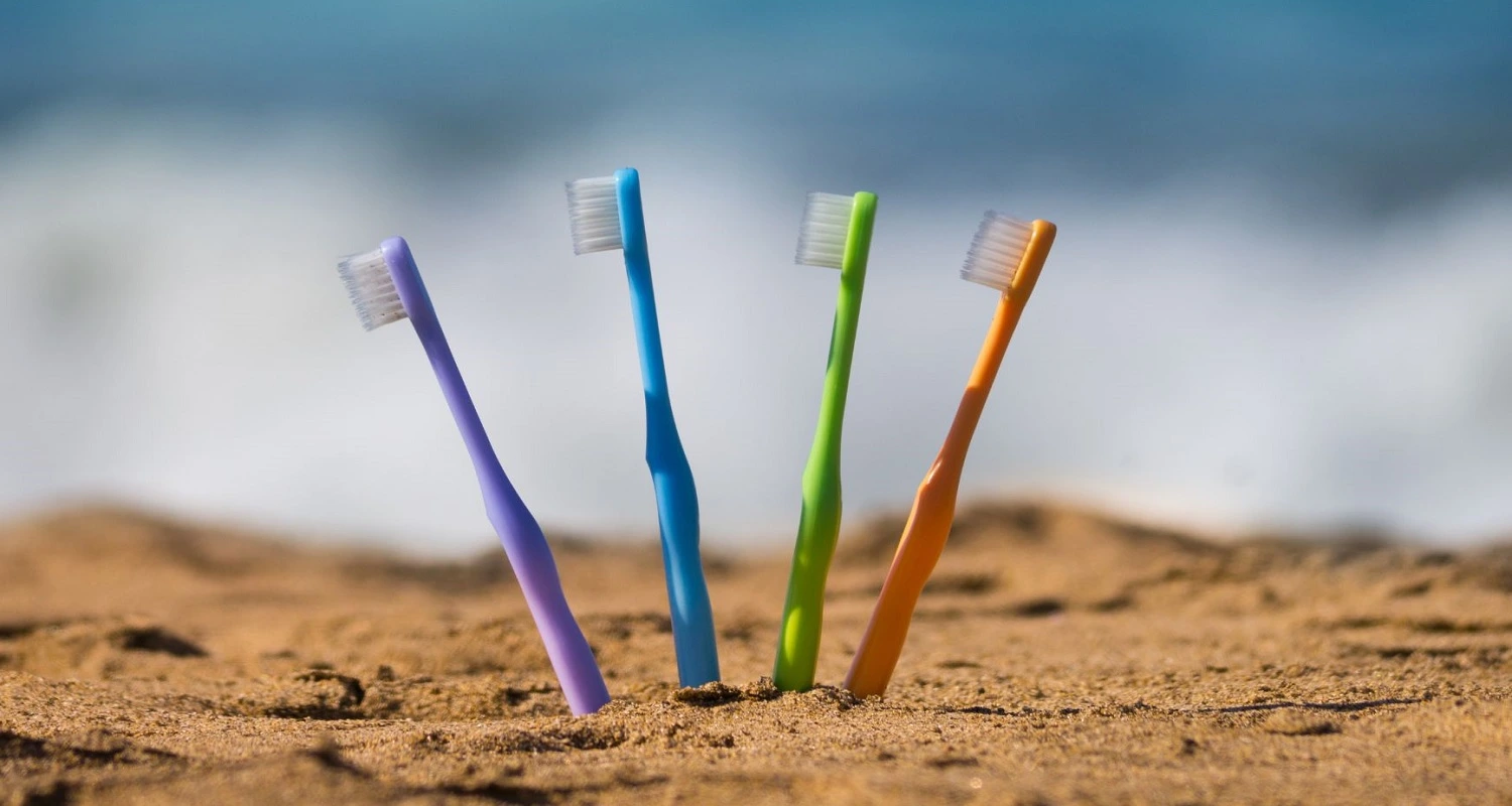toothbrush in beachsand