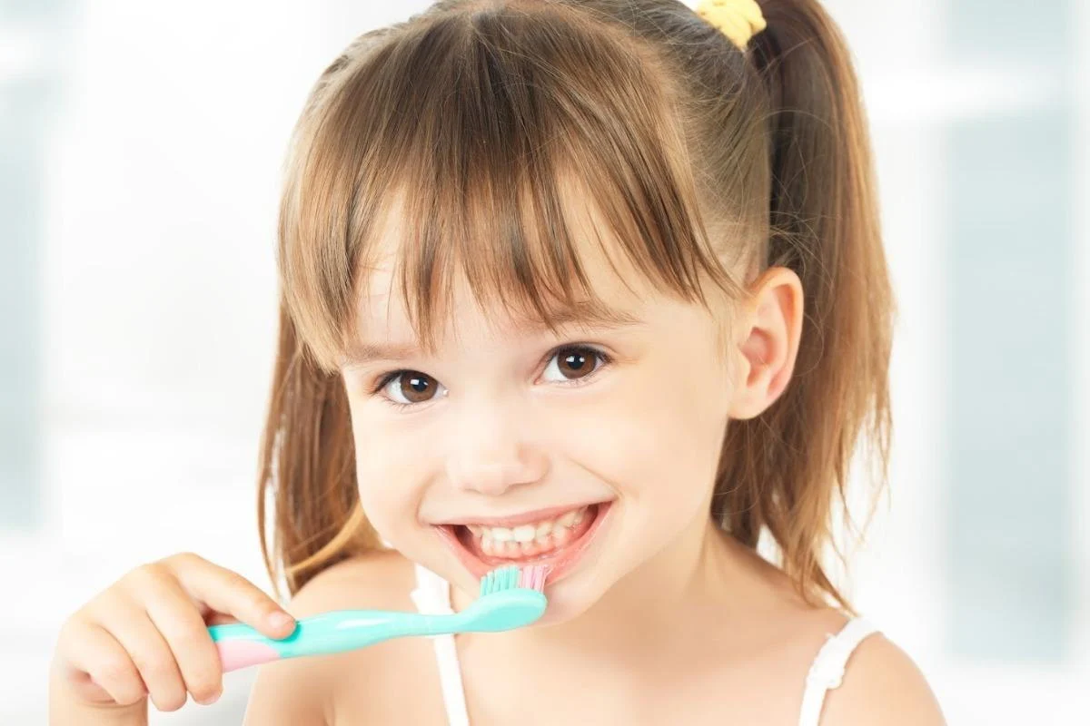 Girl brushing her teeth
