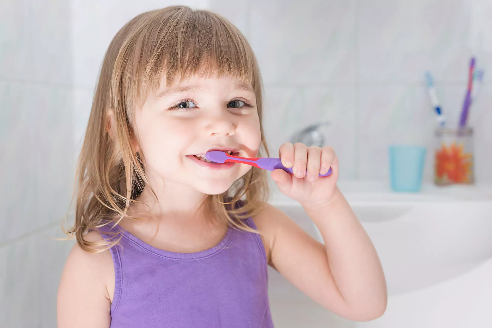 Girl brushing her teeth