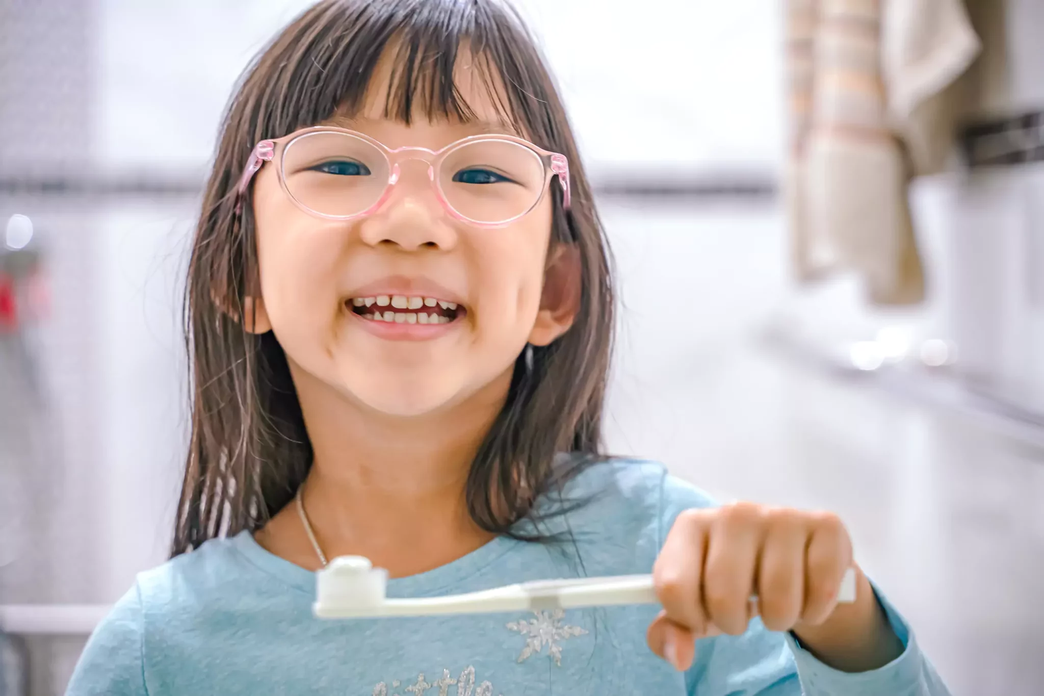 Girl brushing her teeth