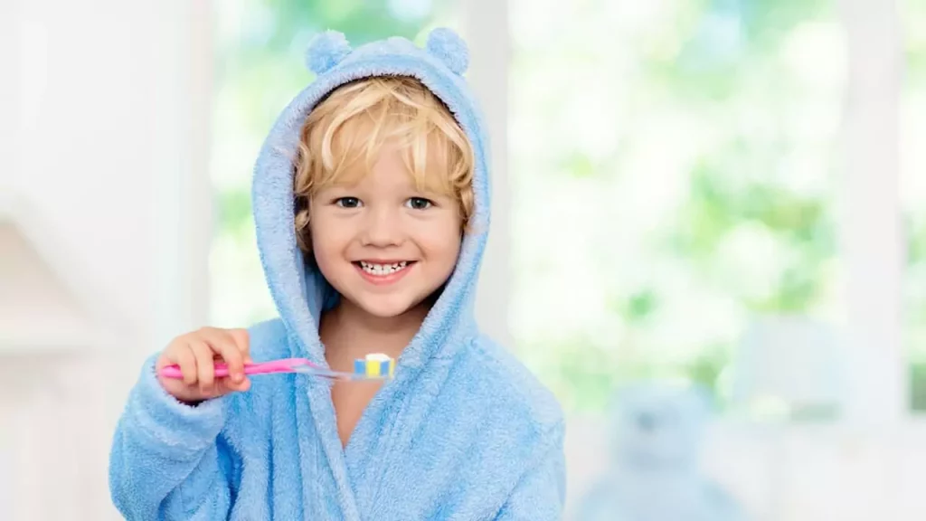 Boy smiling while brushing