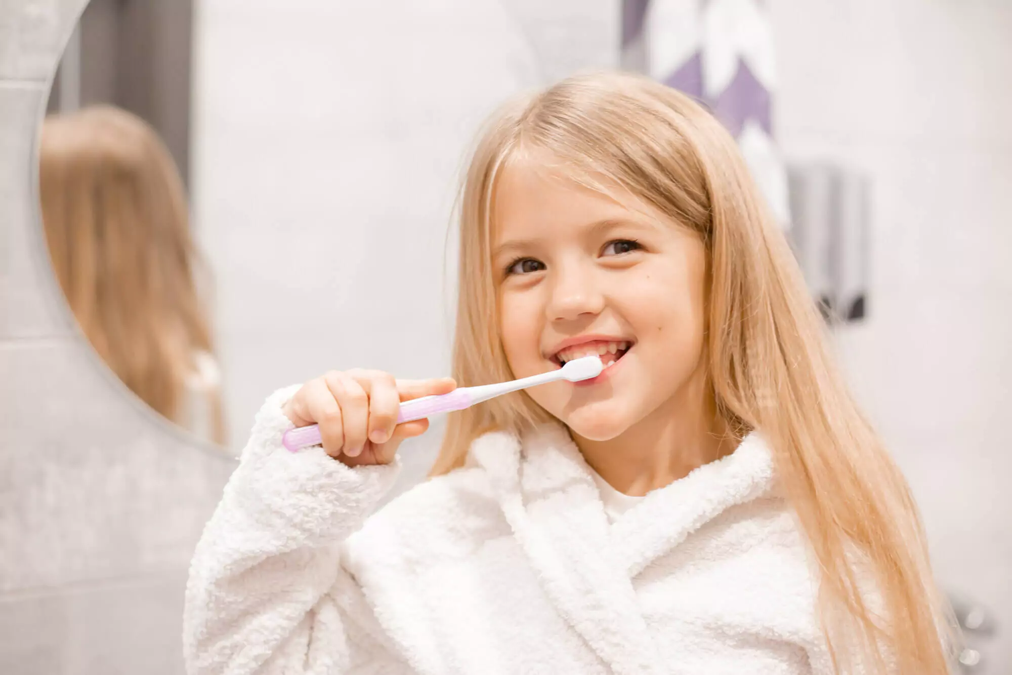 Girl brushing her teeth