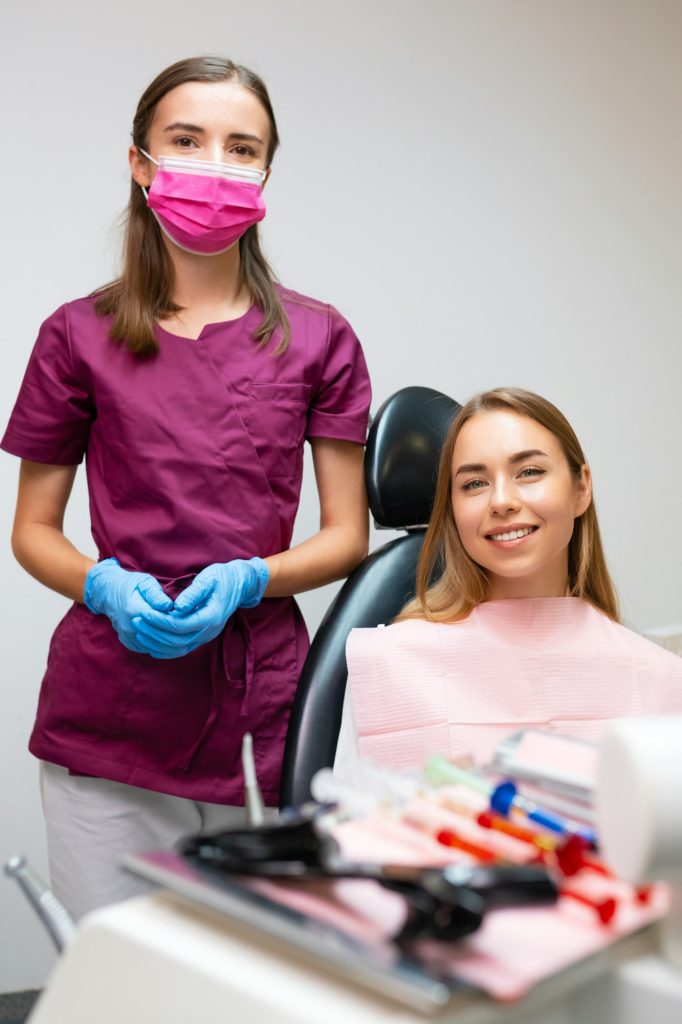 Portrait of dentist and patient in dentist office