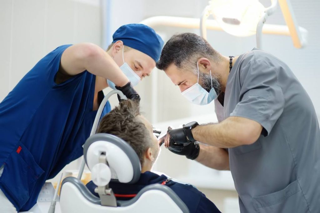 surgeon and nurse during a dental operation