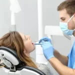 When should you see a dentist about a lip sunburn?