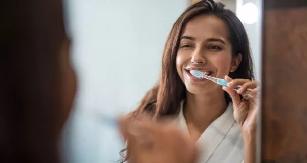 How can you prevent bad breath caused by cavities?