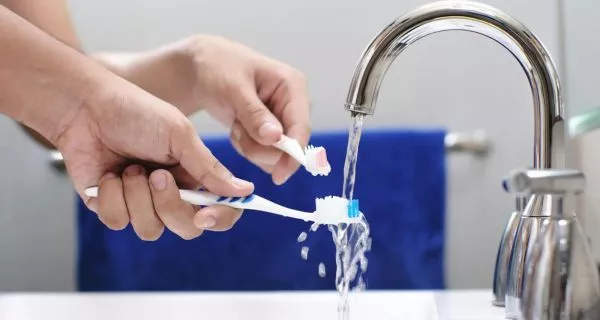 How do dentists recommend caring for your toothbrush?