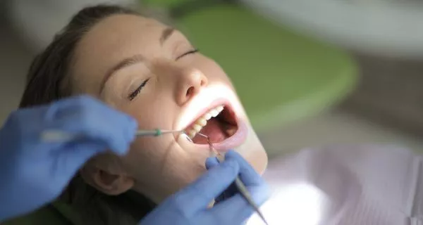 How is a dental deep cleaning done?