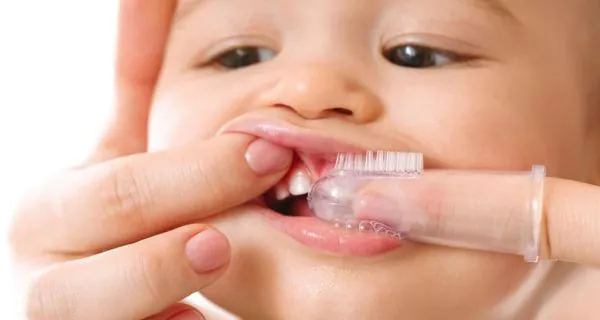 How do I brush my toddler’s teeth?