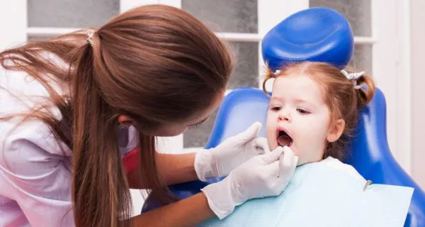 When should toddlers visit the dentist?