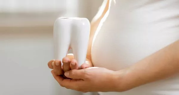 How do hormonal changes affect gums during pregnancy?