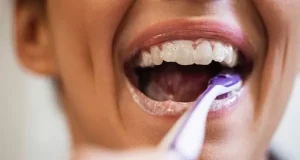 How can cavities in between teeth be prevented?