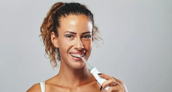 Why are irrigating wisdom tooth sockets needed?