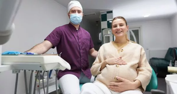 Why do teeth become sensitive during pregnancy?