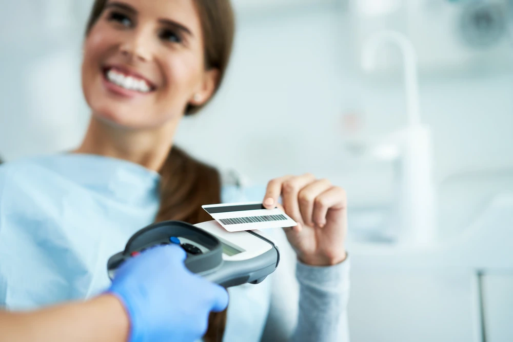 Patient smiling after getting dental care with 0% interest financing in Oxnard