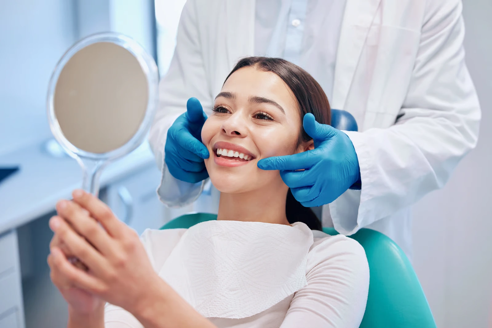 Patient with a brighter smile after teeth whitening in Ventura